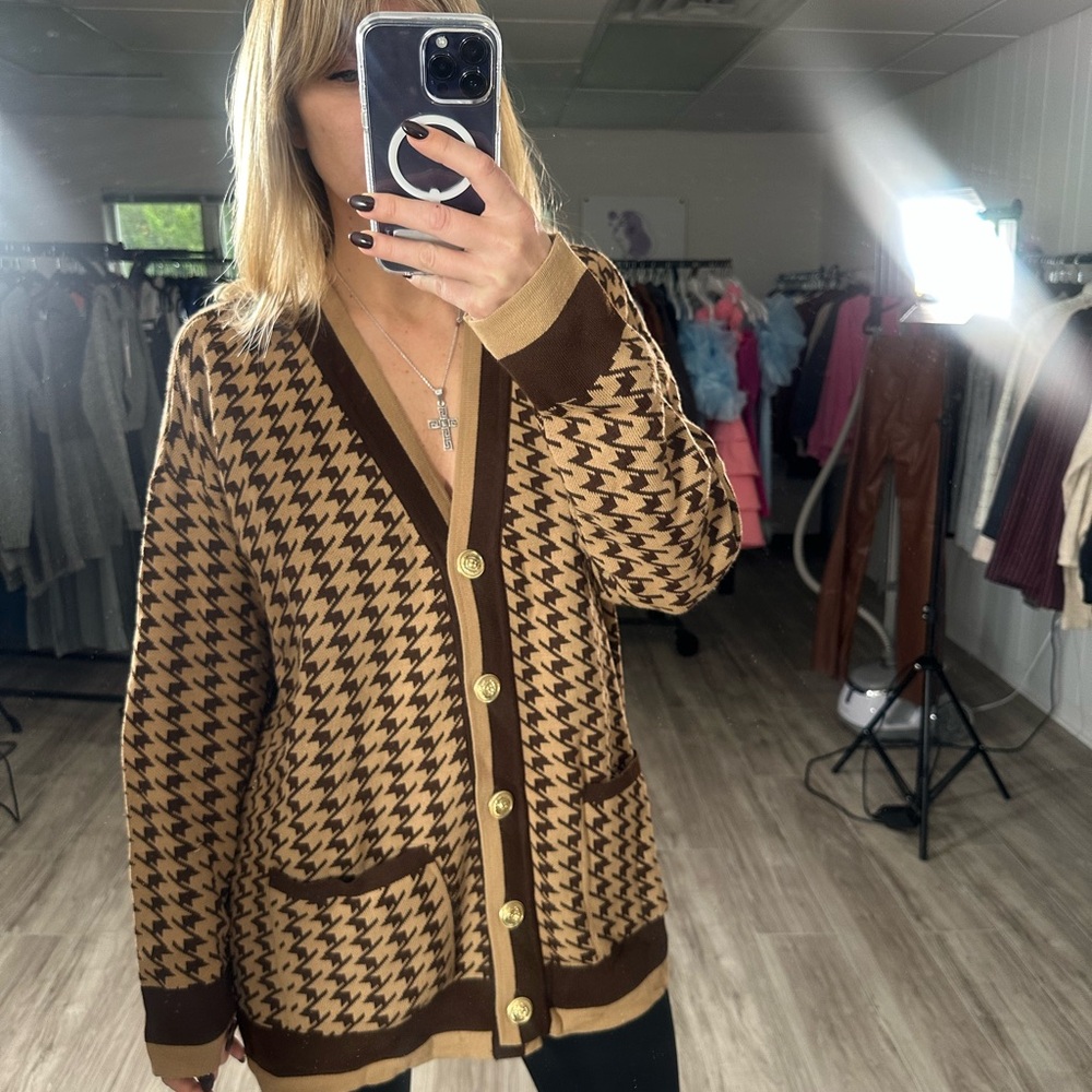 Brown cardigan sweater with houndstooth pattern and V-neck design